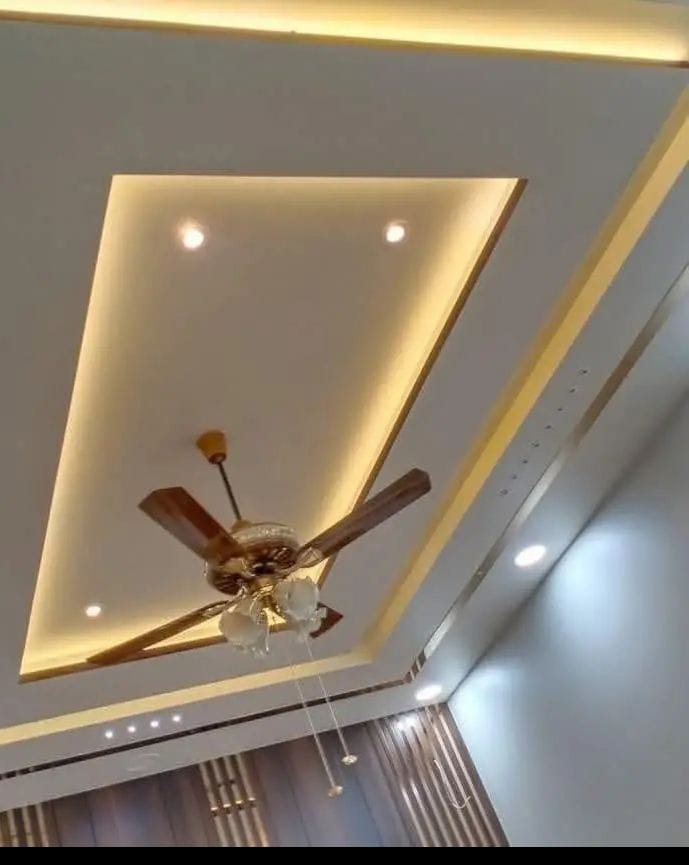 Tray ceiling with cove lighting and a timber-blade fan