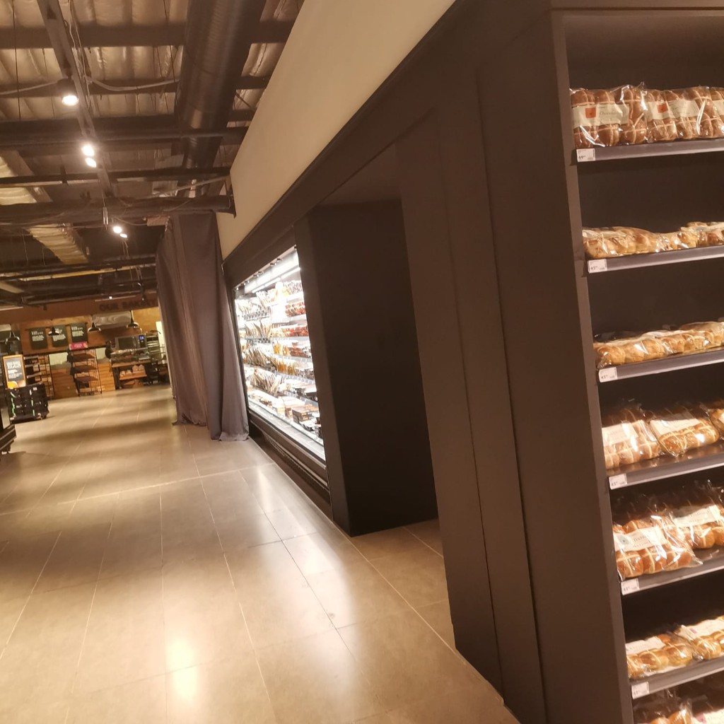 Grocery aisle with bakery joinery and fridge run