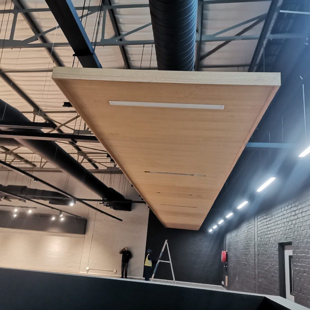 Suspended timber ceiling cloud with linear lights