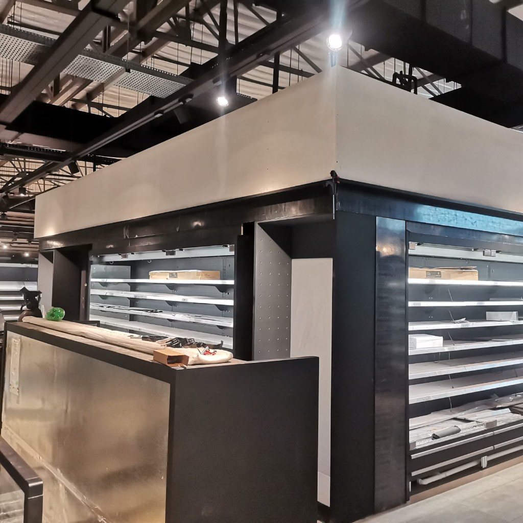 Service counter with stainless front and LED shelves