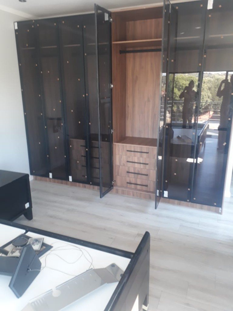 Smoked-glass fitted wardrobe